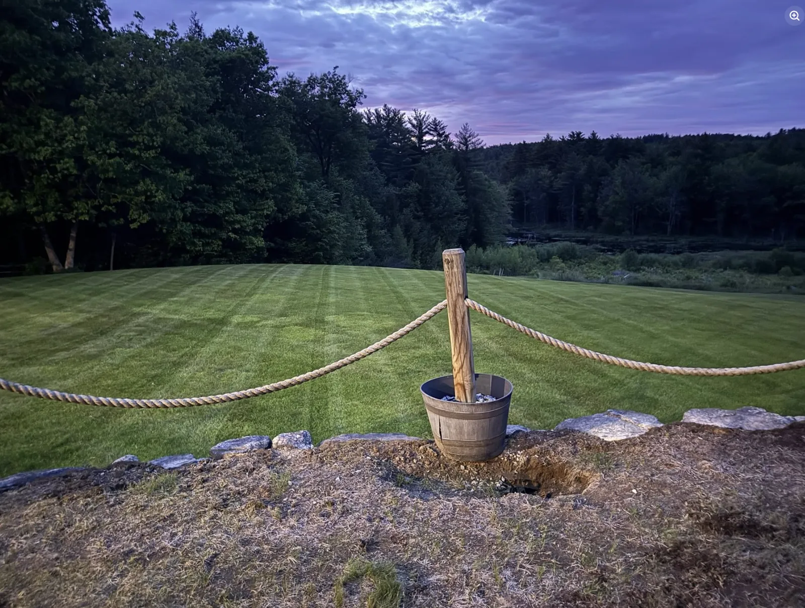 Freshly mowed and striped lawn on a wooded New Hampshire property